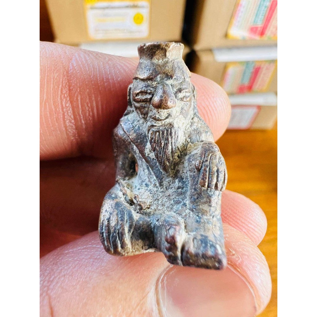 Ancient protection amulet limited edition small hand-carved figure held between fingers