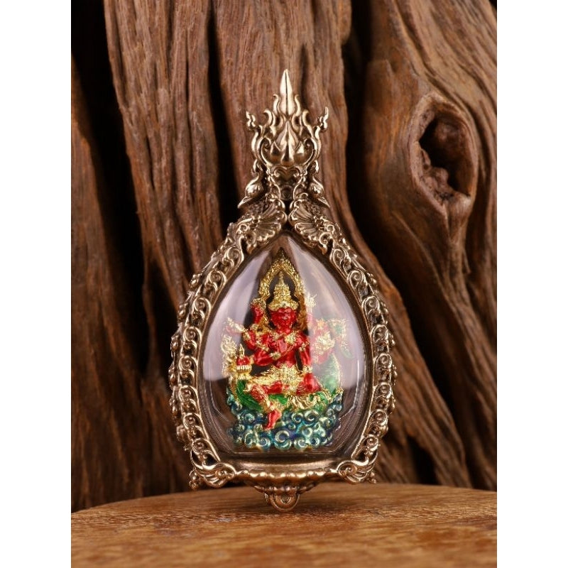 Intricately designed Phra Phrom amulet for prosperity in a decorative silver frame