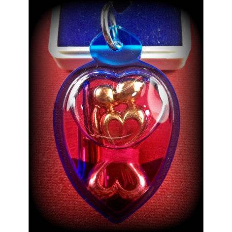 Dual Charm Thai Love Pendant – Elegant Twin Figures in Herbal Oil Casing | 泰式双人魅力吊坠 – 植物精油封装的双体工艺饰品 - Thai Blessing Co