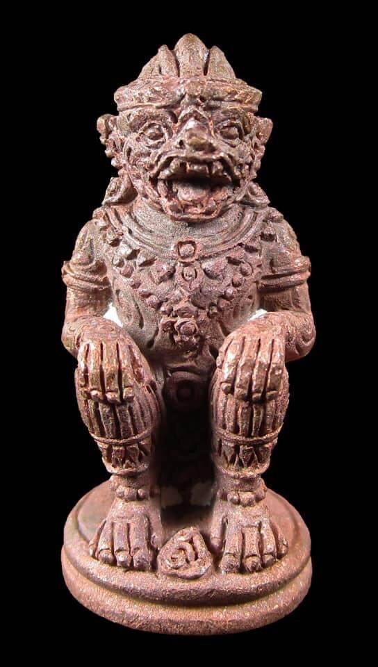 Brown carved Hanuman amulet statue with ornate jewelry and base for protection Hanuman Saensamrit Amulet .