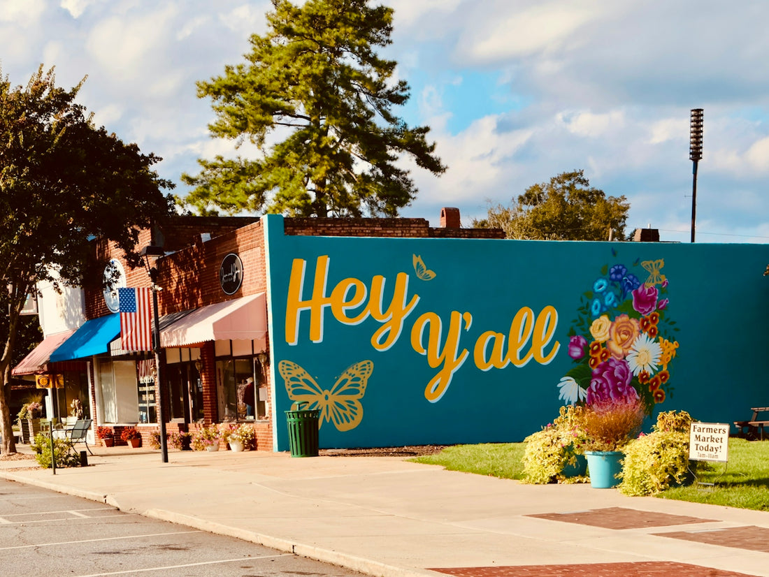 Colorful mural with hey y'all and butterflies