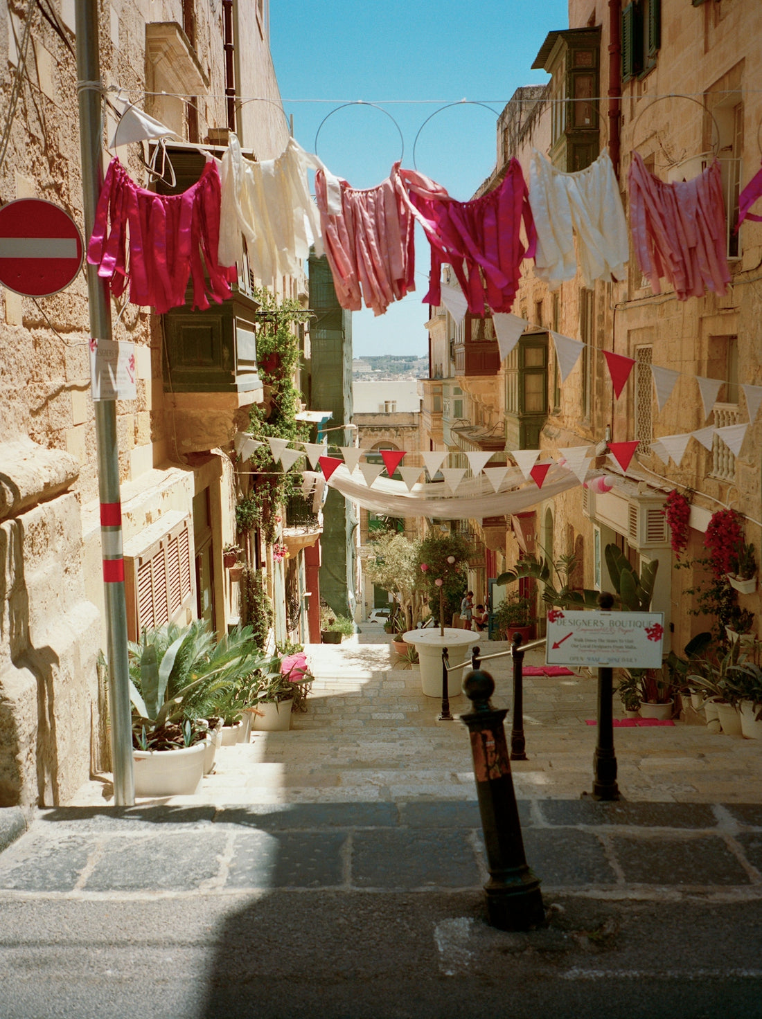 Laundry hangs across a narrow european street