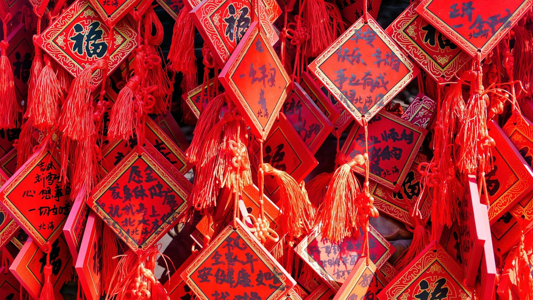 Red charms with chinese calligraphy hang together