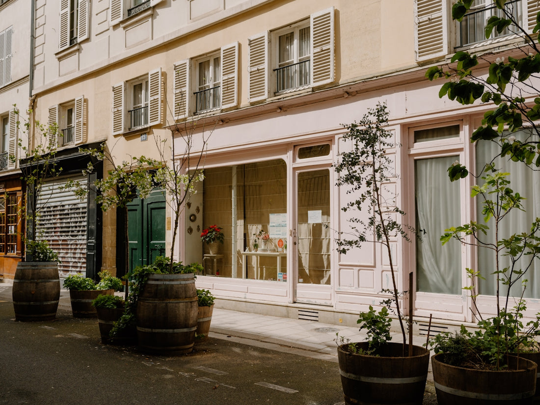 Charming parisian street with shops and barrels