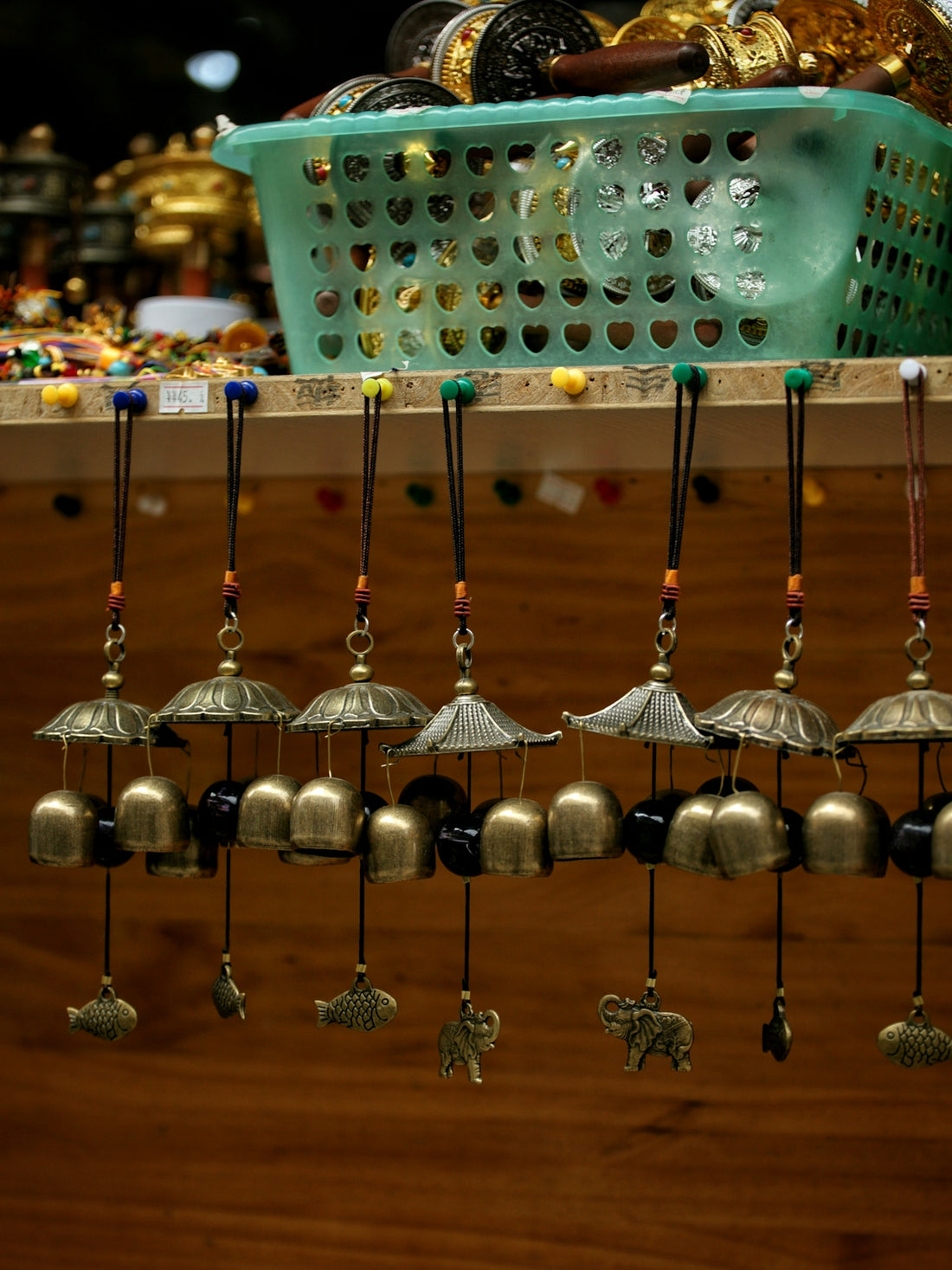 Brass wind chimes with animal charms hanging