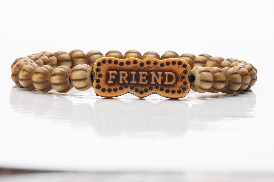 Beaded bracelet with friend charm.