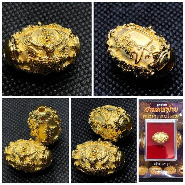 Thai protection amulet for prosperity, intricately designed with detailed engravings and a golden finish