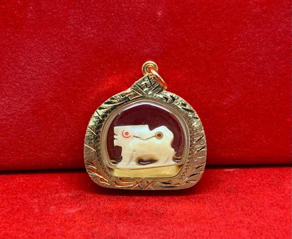 Carved Bone Singha Amulet with Musk Oil Coating - Blessed by Luang Pu Im of Wat Thung Na Mai, Nakhon Si Thammarat Default Title