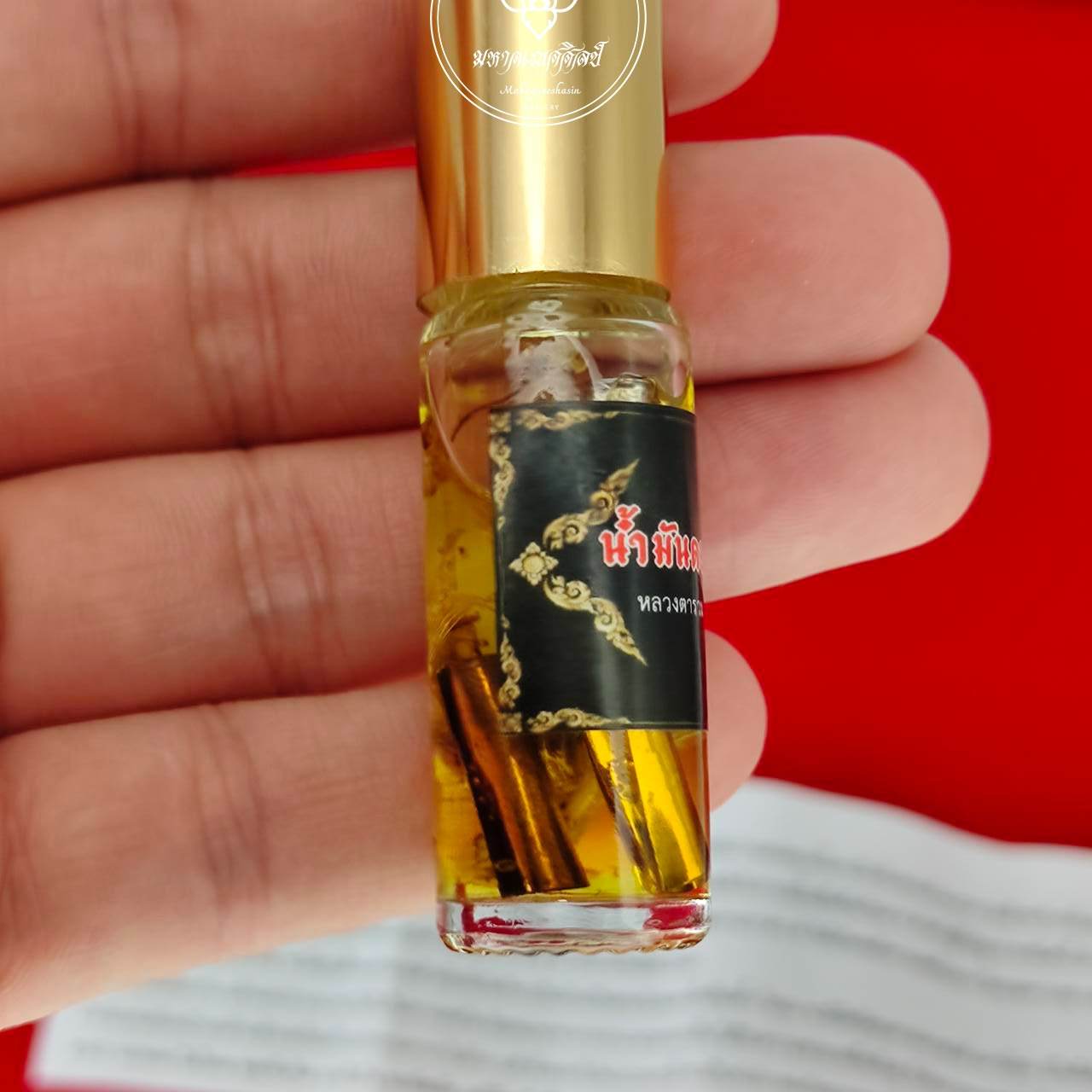 Golden Flower Oil – Seductive Prosperity Elixir By Luangta Ruam, Wat Khok Samran Temple, Phetchabun, Thailand 金色花油 • 魅力與財富兼具的祕法香油 - Thai Blessing Co