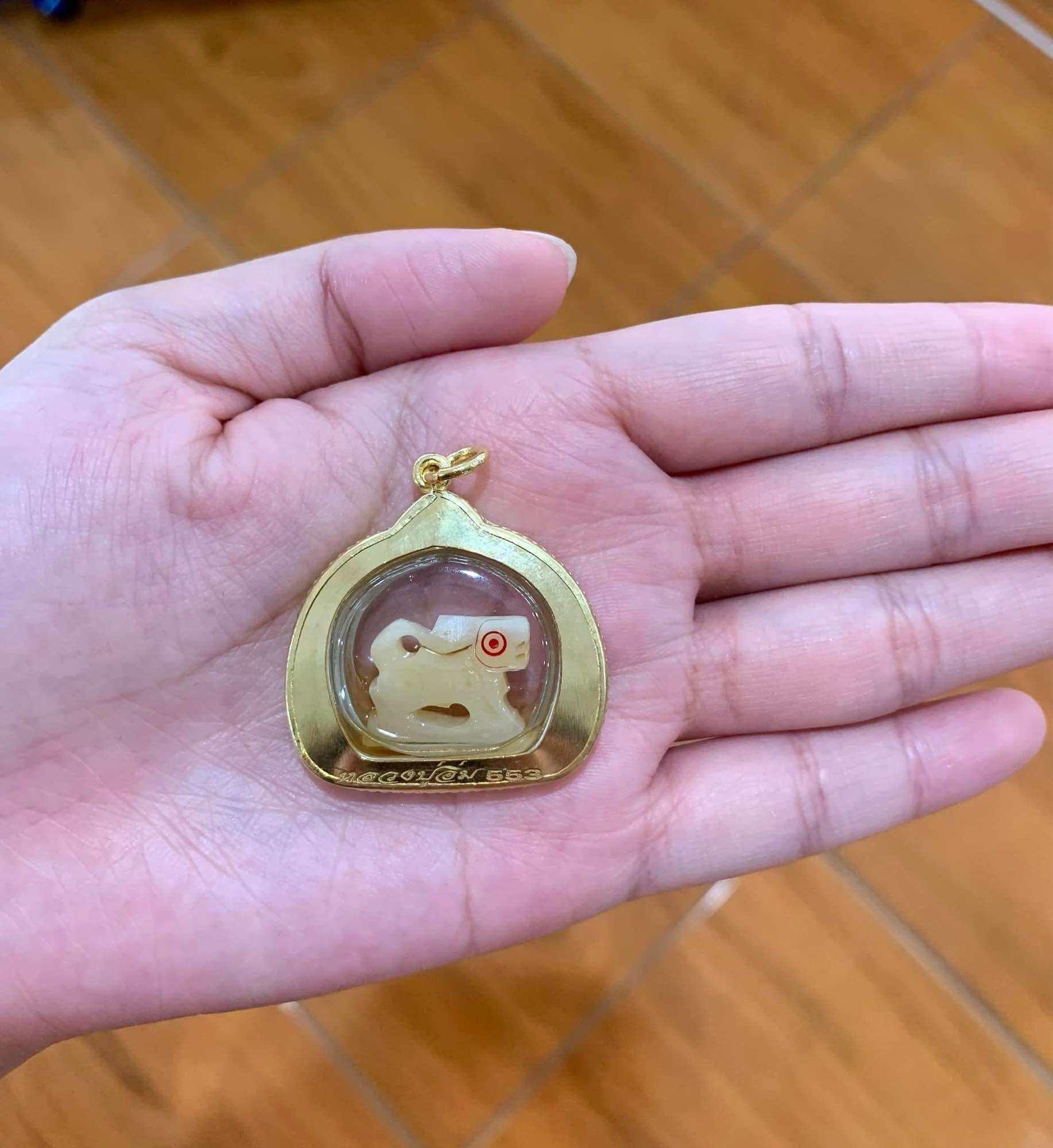 Carved Bone Singha Amulet with Musk Oil Coating - Blessed by Luang Pu Im of Wat Thung Na Mai, Nakhon Si Thammarat