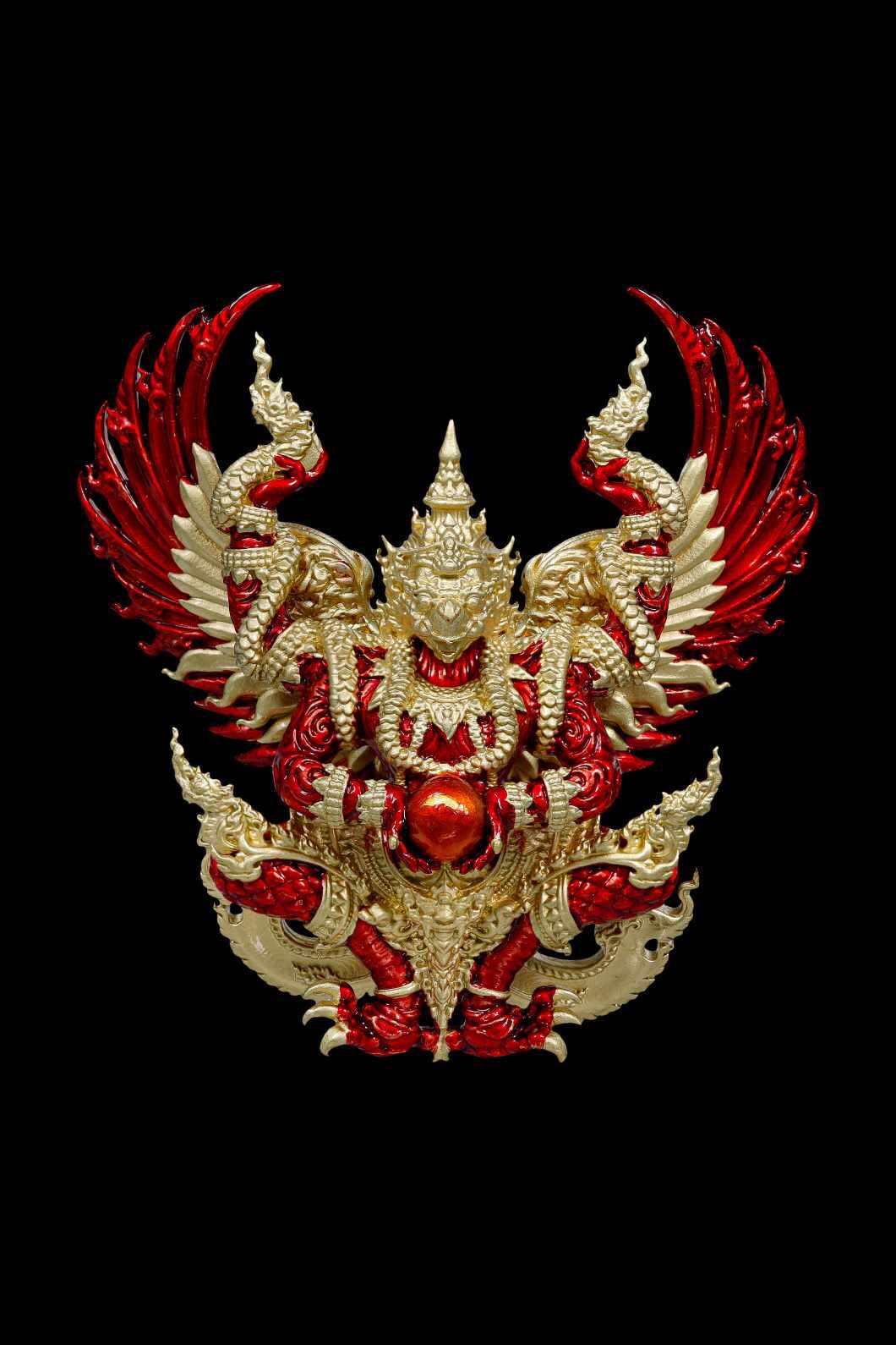 Authentic Thai guardian amulet featuring intricate designs with red and gold detailing