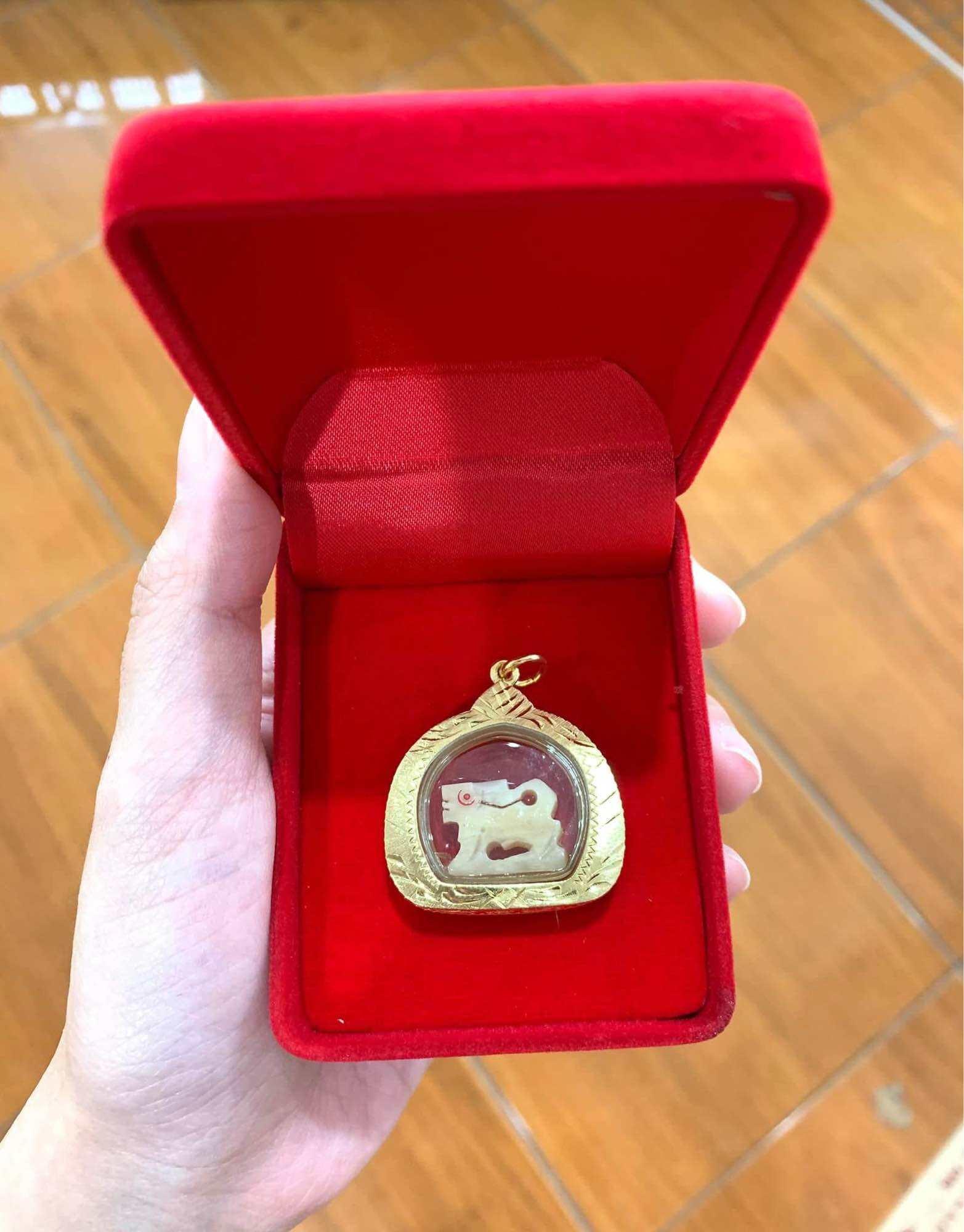 Carved Bone Singha Amulet with Musk Oil Coating - Blessed by Luang Pu Im of Wat Thung Na Mai, Nakhon Si Thammarat