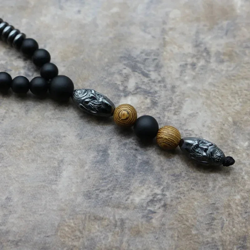 🗿 The "Ancestral Sage" Necklace: 6mm Hematite & Carved Tribal Elder Head Pendant (Wisdom & Protection)