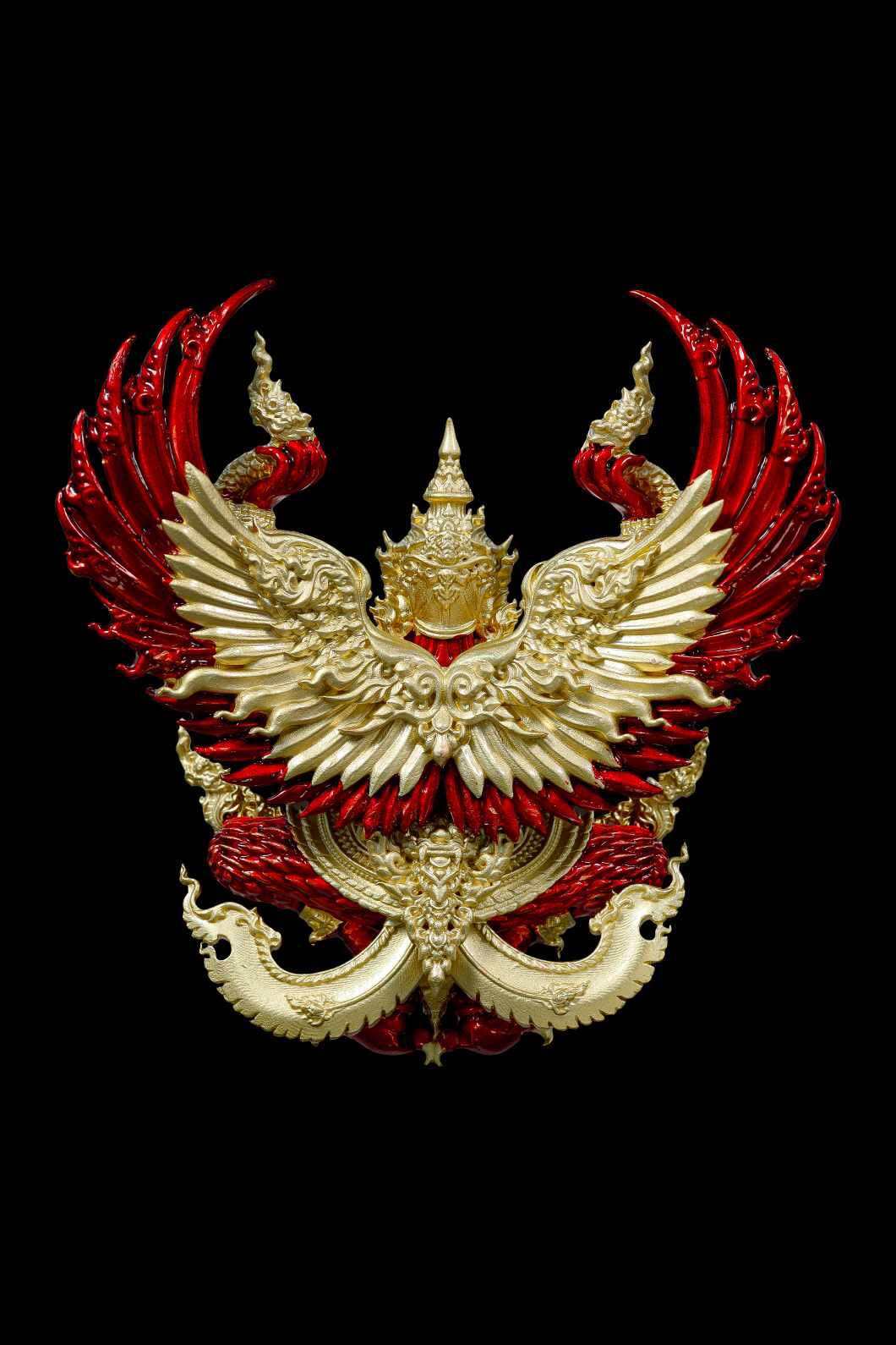Authentic Thai guardian amulet featuring intricate red and gold design with mythical bird motifs