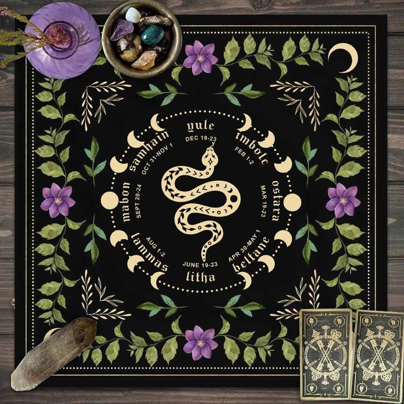 Black astrology tarot tablecloth featuring gold snake sabbat wheel leafy floral border crystals and tarot cards
