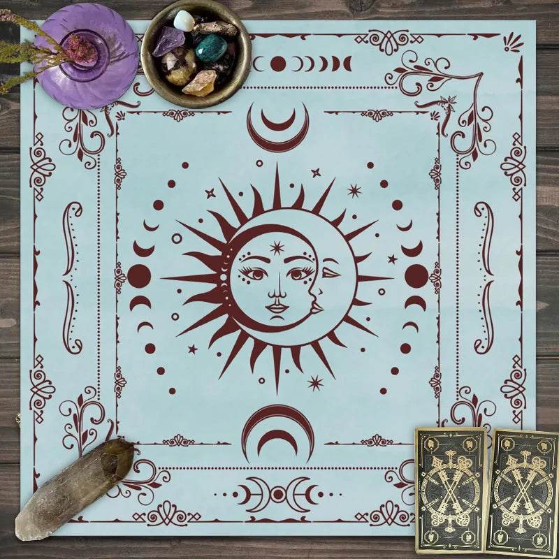 astrology tarot tablecloth with central sun and moon face, moon phases and ornate border, styled with crystals and tarot cards