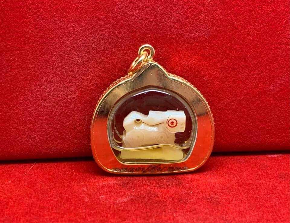 Carved Bone Singha Amulet with Musk Oil Coating - Blessed by Luang Pu Im of Wat Thung Na Mai, Nakhon Si Thammarat