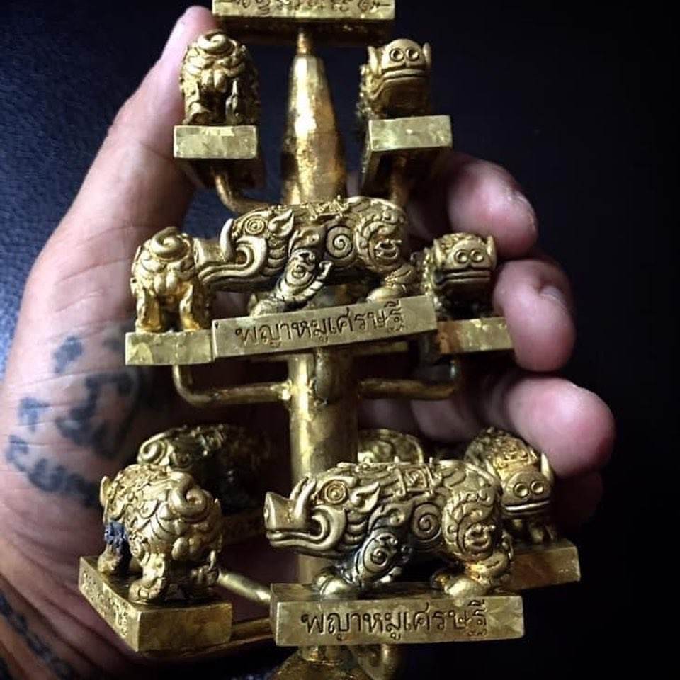 Phaya Moo Setthi Amulet - Luang Por Whan’s brass multi tier boar shrine amulet held in hand