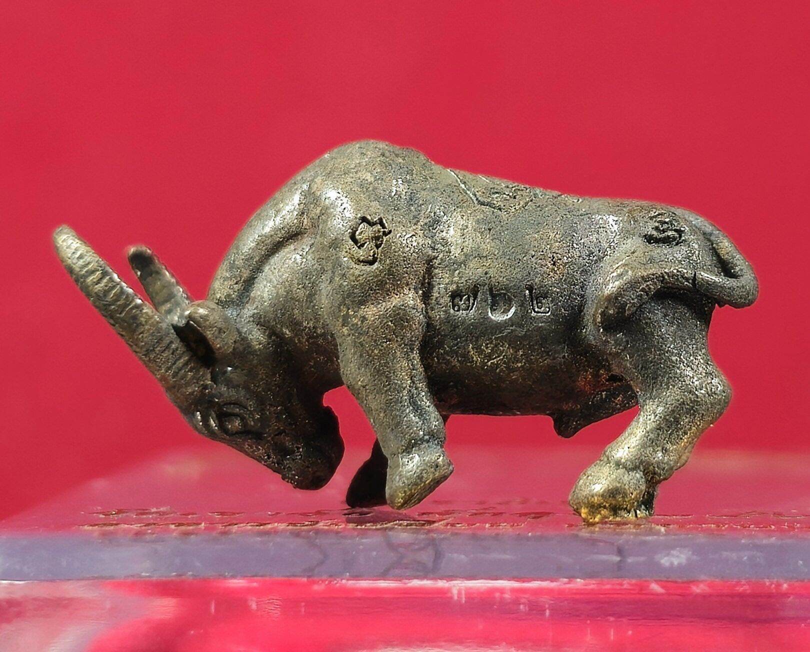Ajan Plean Hatyannont sacred buffalo charm metal amulet with engraved markings and detailed craftsmanship