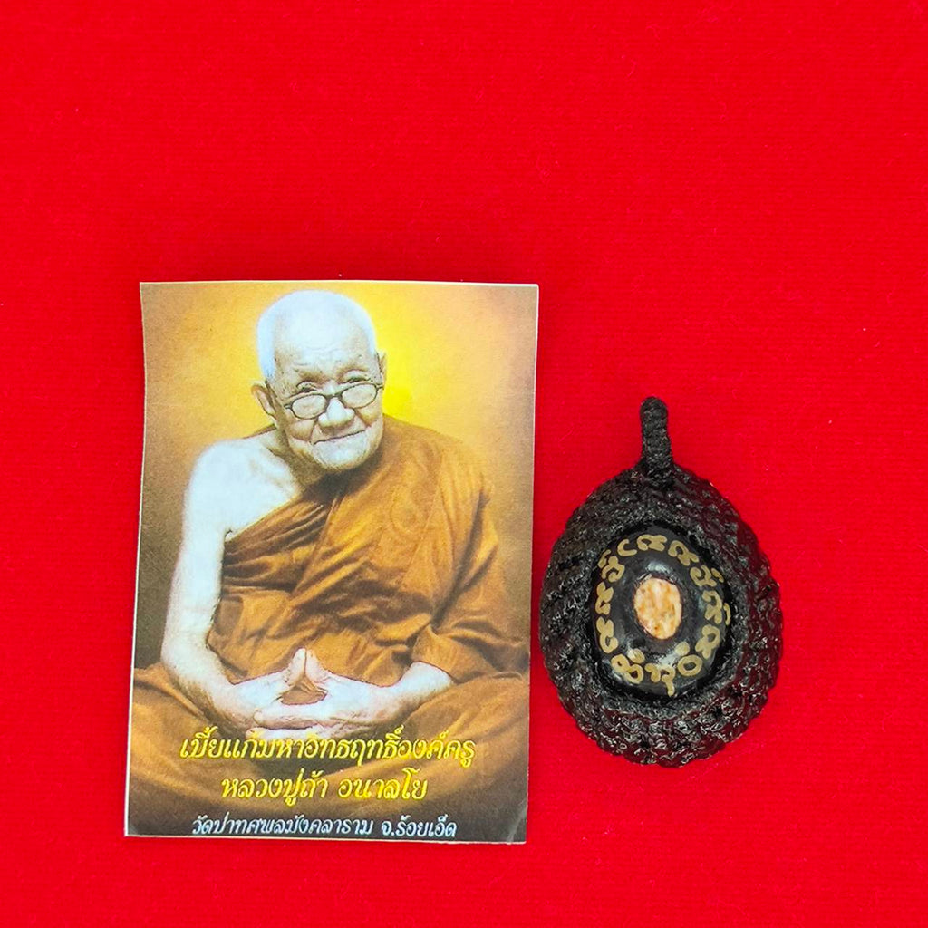 Bia Gae amulet for protection with accompanying card featuring a monk's image for spiritual well-being