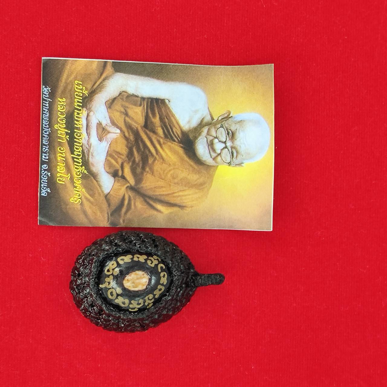 Bia Gae amulet for protection featuring a traditional Thai monk image and intricately designed casing