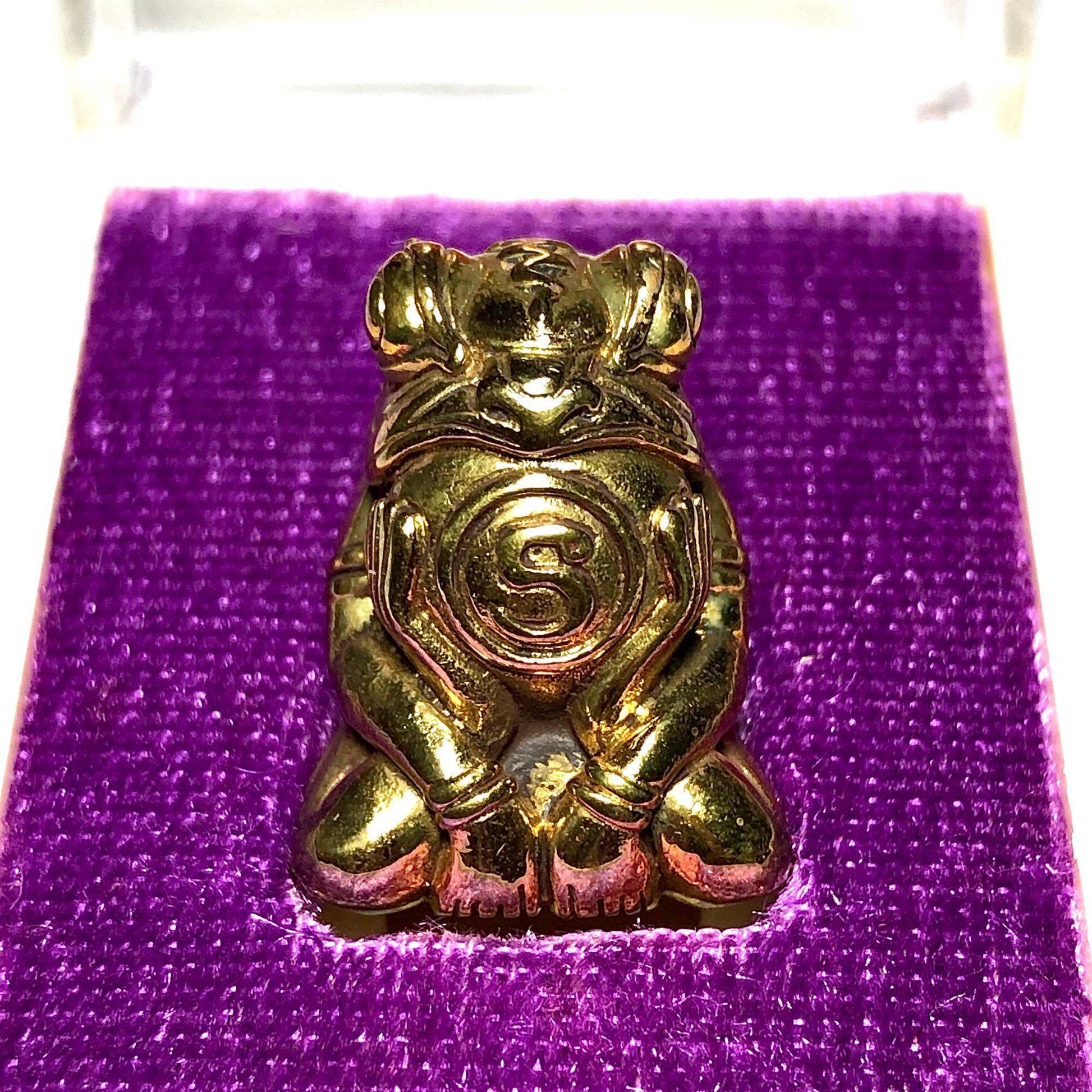 Phaya Kob Kin Duean gold frog amulet pendant on purple velvet display box by Thai Blessing Co