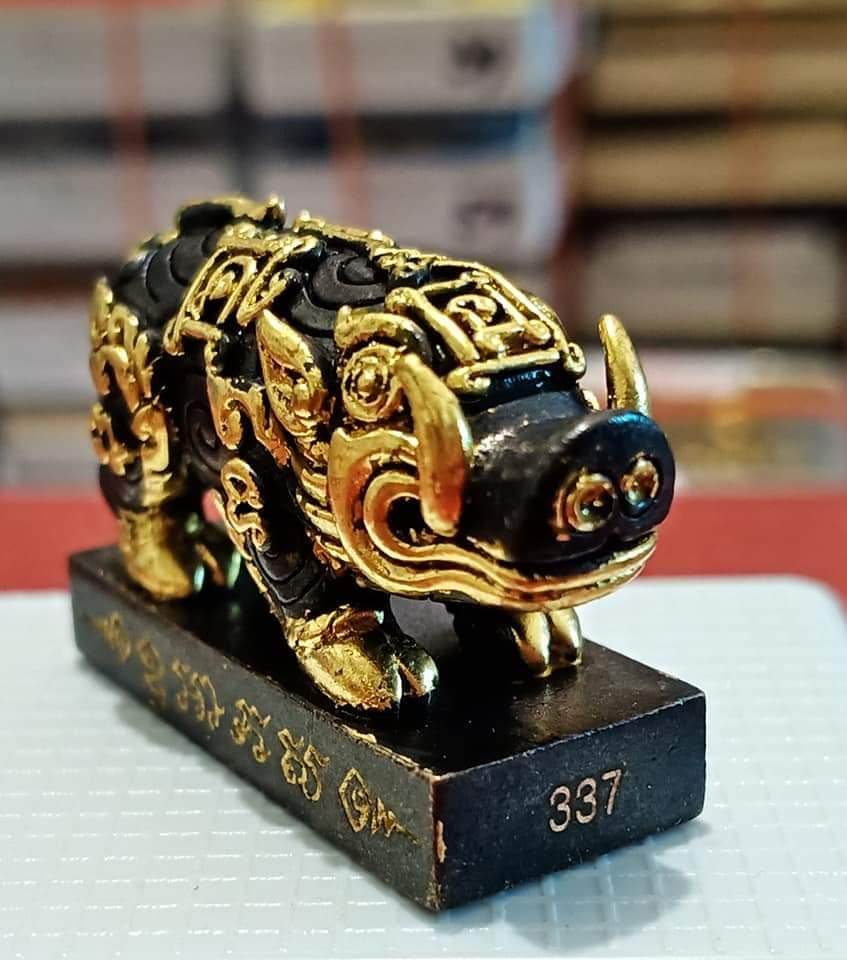 Black and gold Phaya Moo Setthi amulet statue on numbered base 337 for home feng shui and prosperity