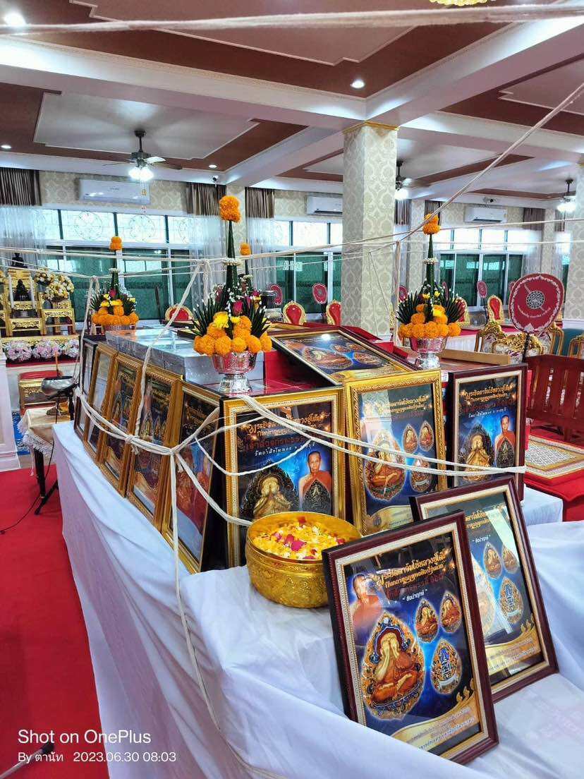 Display of Phra Pidta amulet for prosperity in an ornate Thai decor setting
