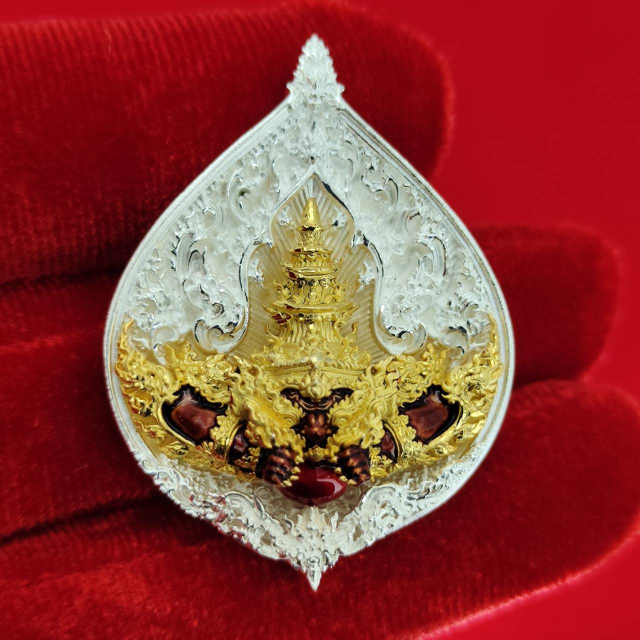 Rahu amulet for fortune in intricate silver and gold design, symbolizing luck and wealth.