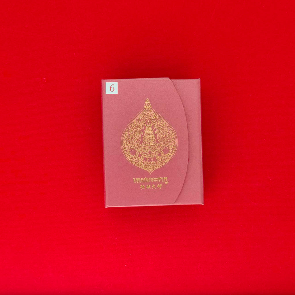 Rahu amulet for fortune in an ornate packaging by Thai Blessing Co with elegant design.