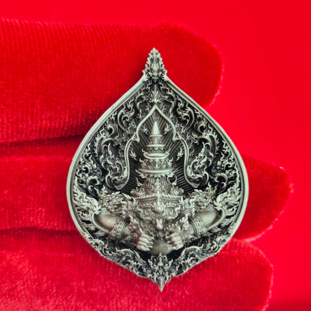 Intricately designed Rahu amulet for fortune, featuring detailed sculpture and ornate patterns