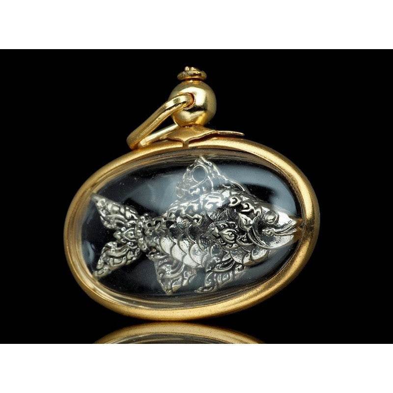 Thai Tapian fish charm for wealth silver carved fish amulet in gold oval frame pendant from Thai Blessing Co