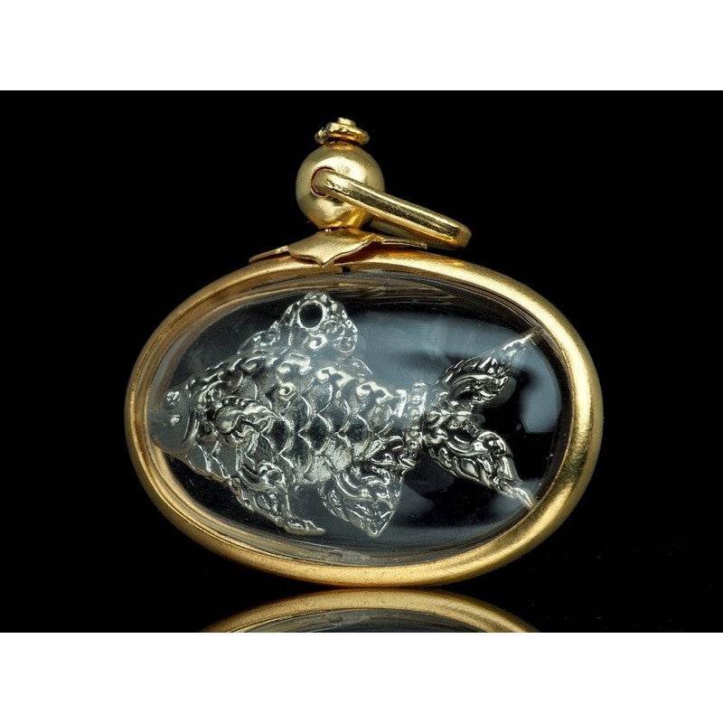 Thai Tapian fish charm for wealth silver fish pendant in glass oval gold frame amulet by Thai Blessing Co