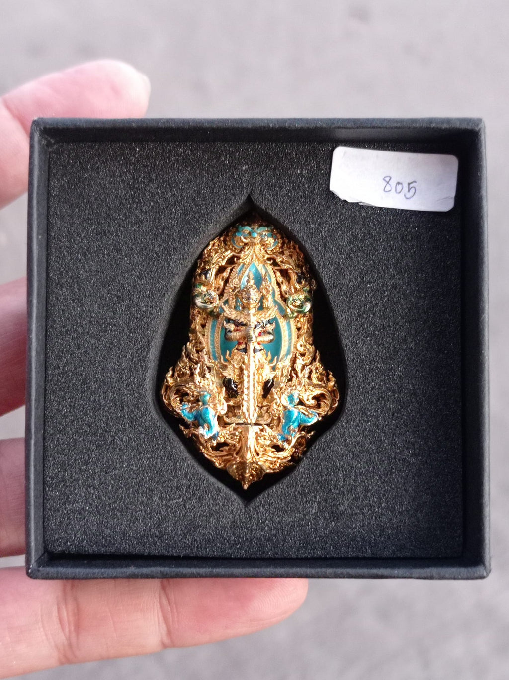 Thao Wessuwan amulet for protection in ornate gold and turquoise design with box