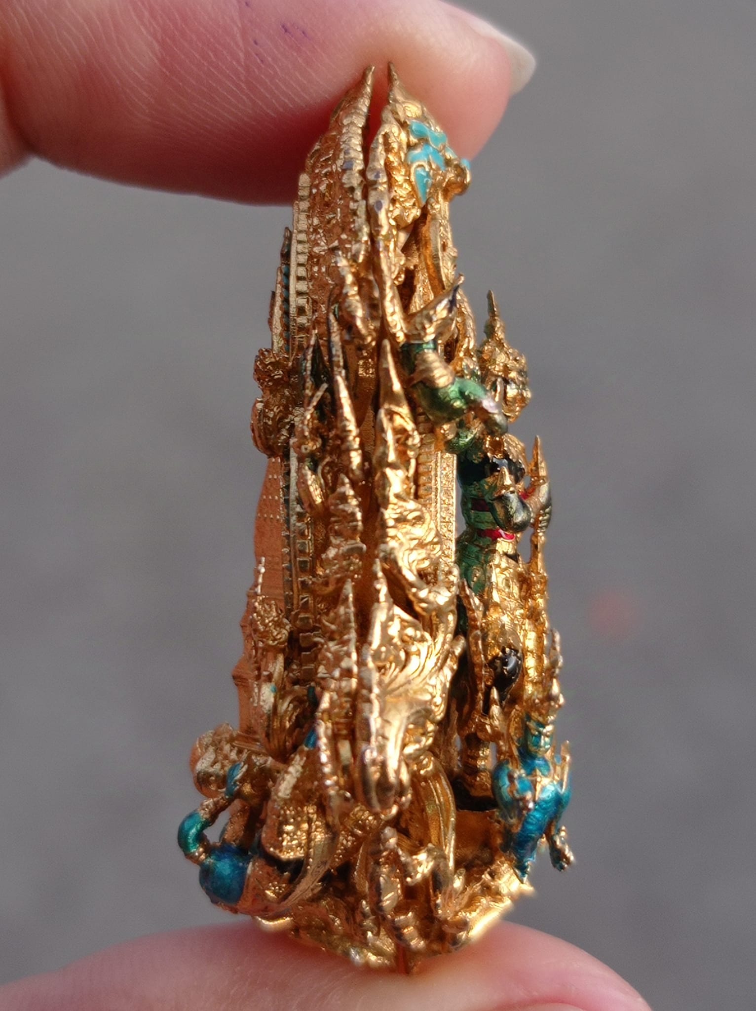 Intricately designed Thao Wessuwan amulet for protection showcasing detailed craftsmanship and vibrant colors