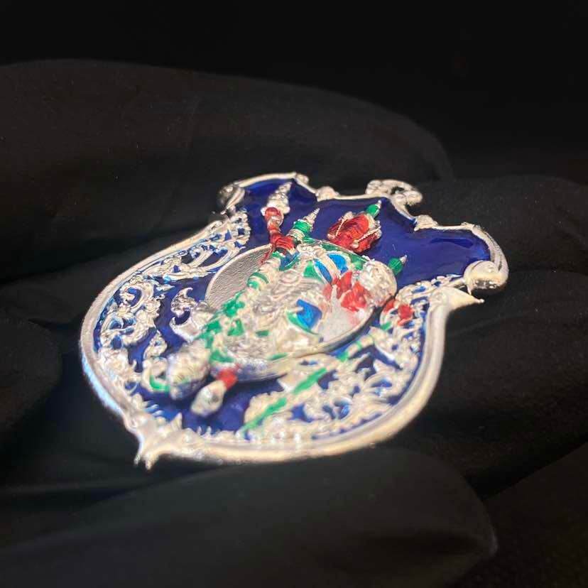 Thai enamel amulet pendant with silver filigree frame and colorful deity figure Thao Wessuwanno Sodaprom
