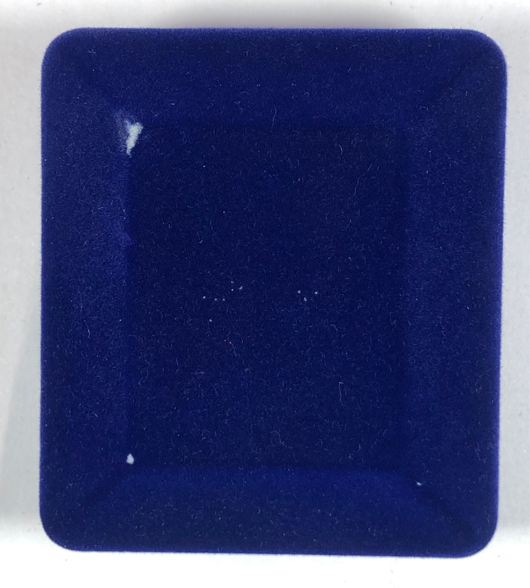Empty blue velvet jewelry box for tiger amulet for protection bracelet display