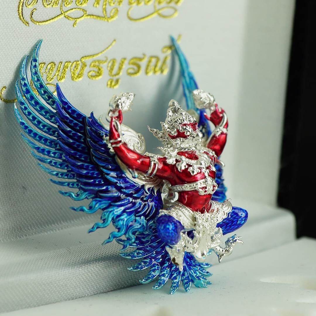 Phaya Krut Sataphusay Amulet detailed red and silver Garuda figurine with iridescent blue wings pendant