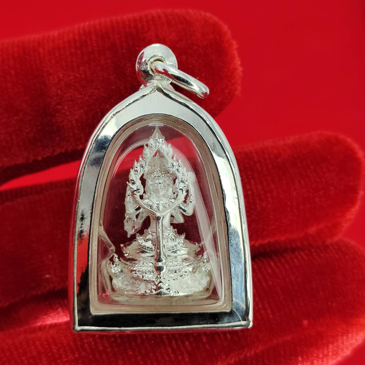 Brahma Naga amulet with silver frame pendant in clear case on red velvet detailed deity and naga design