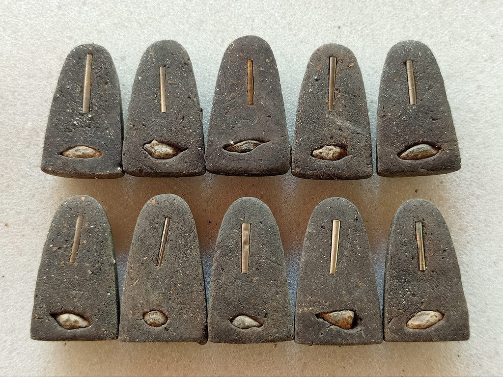Set of 11 dark triangular Thai amulet pendants with embedded metal pin and shell relic Luang Pu Thuad commemorative amulet 2023