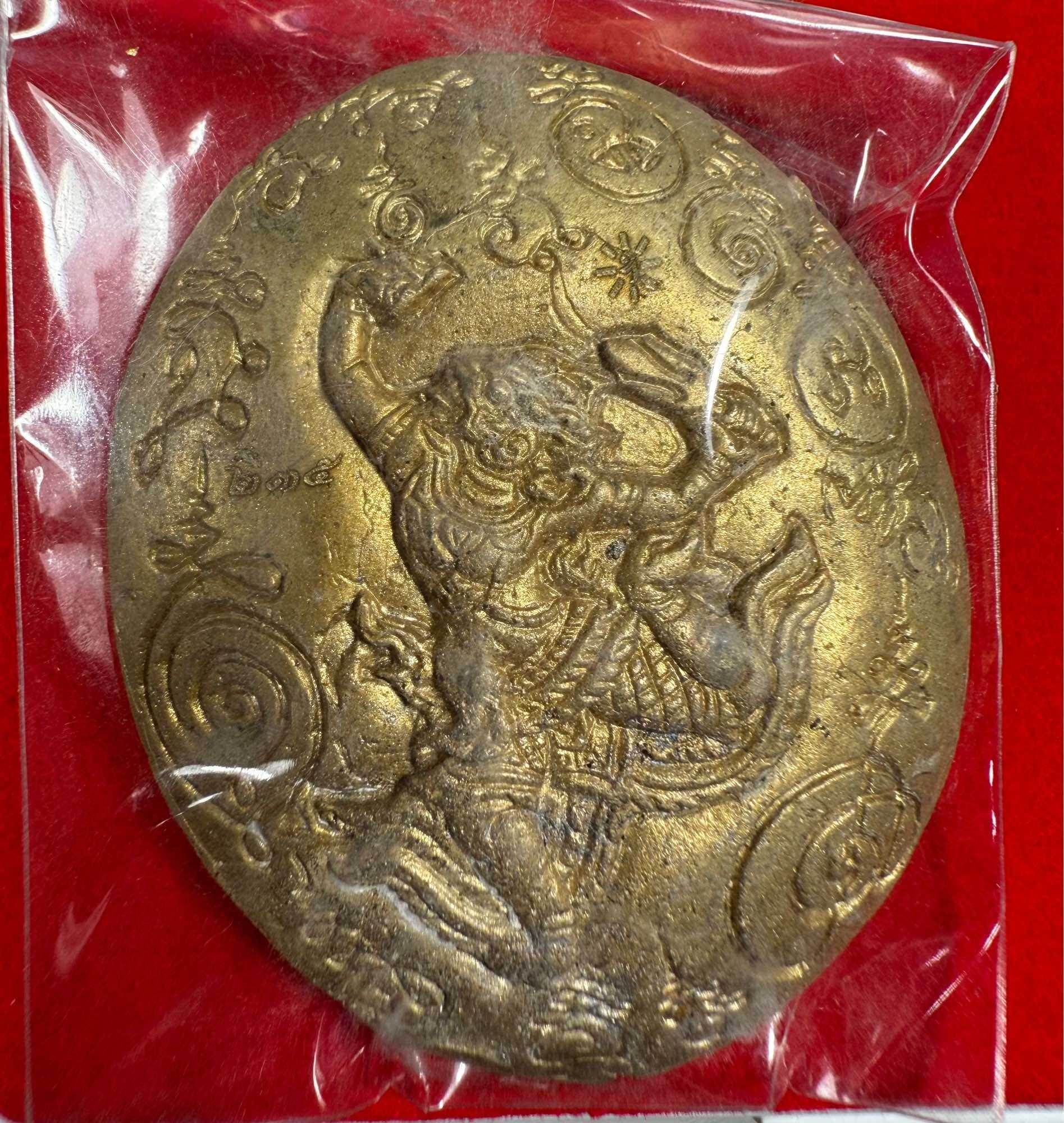 Maharaj Phangphakarn amulet Phaya Chingchai edition gold oval embossed elephant warrior pendant in plastic sleeve