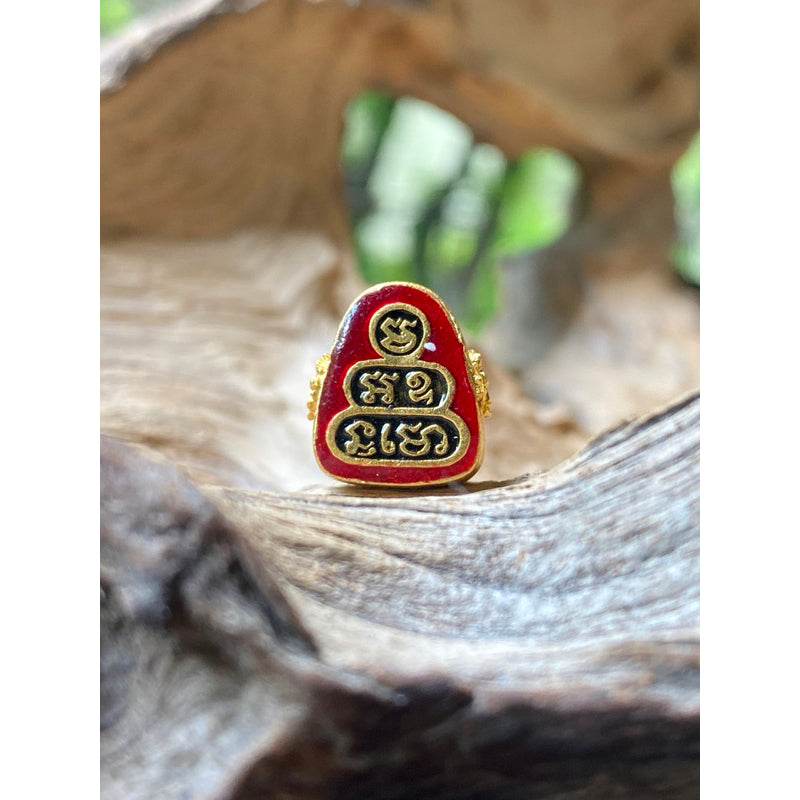 Small Phra Pidta amulet gold enamel with red lacquer and Thai script by Thai Blessing Co for protection