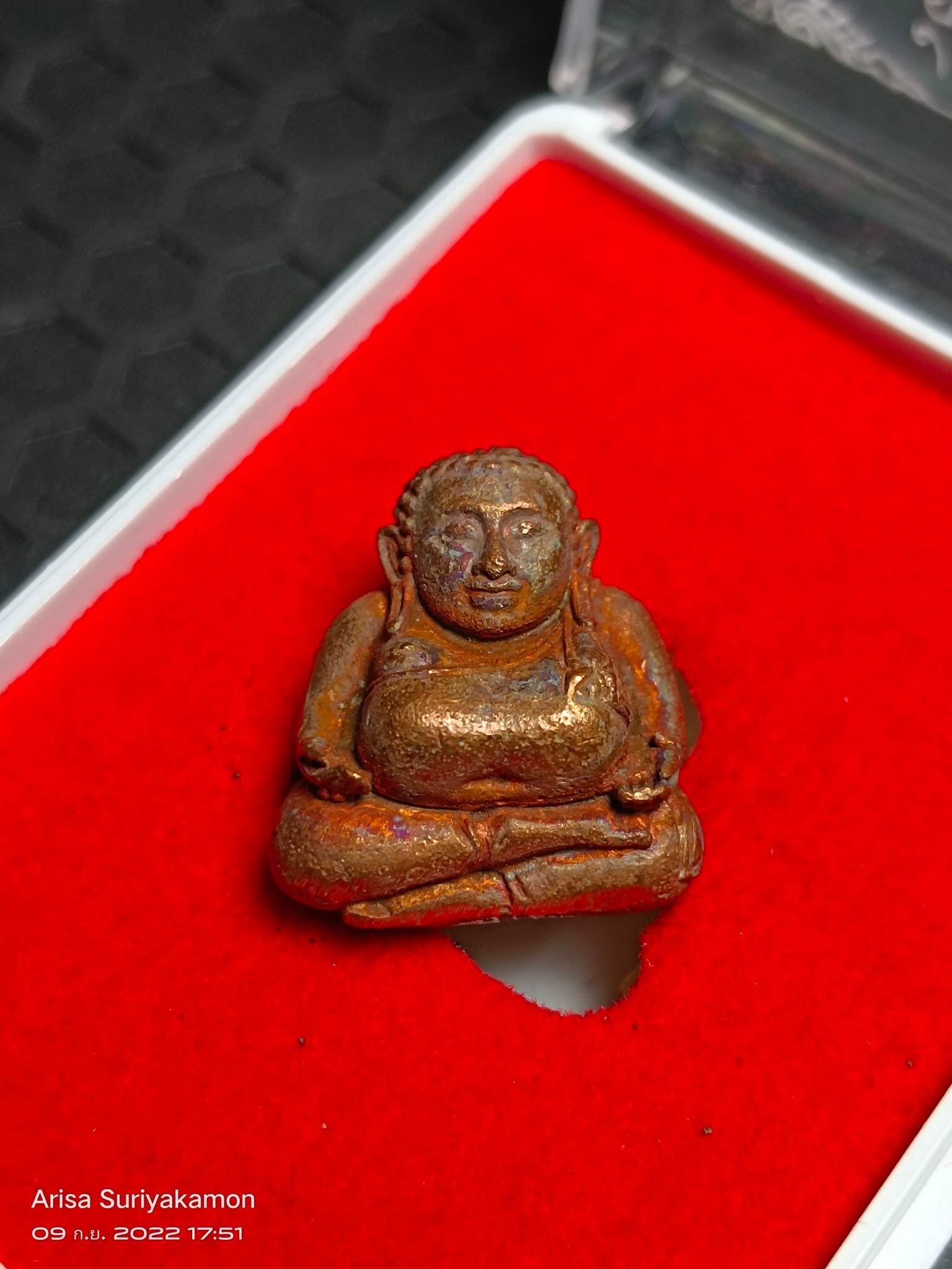 Sangkajai Buddha amulet for wealth small antique bronze seated amulet on red velvet display case