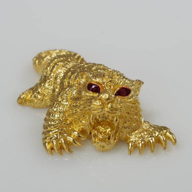 Gold tiger amulet with red gem eyes, decorative gold talisman for luck and protection Thai amulets for wealth