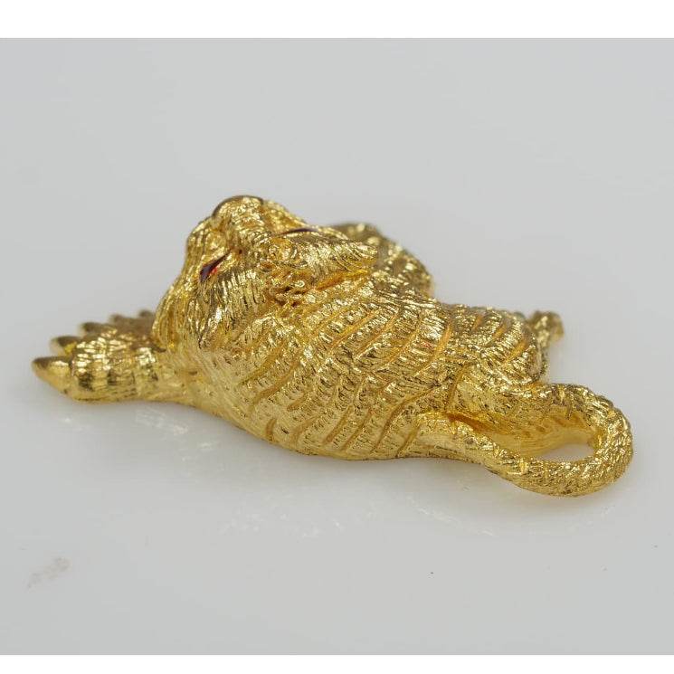 Gold reclining tiger charm with red eye from Thai Blessing Co Thai amulets for wealth