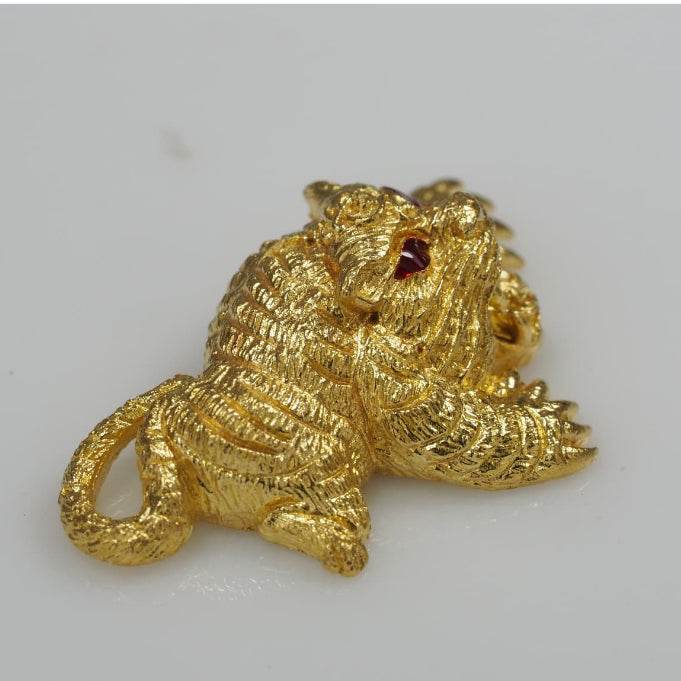 Gold Thai tiger amulet with red eyes detailed texture small decorative charm Thai amulets for wealth