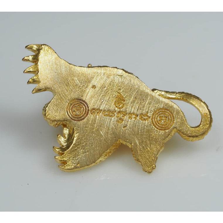 Gold animal shaped metal talisman with engraved symbols by Thai Blessing Co Thai amulets for wealth charm