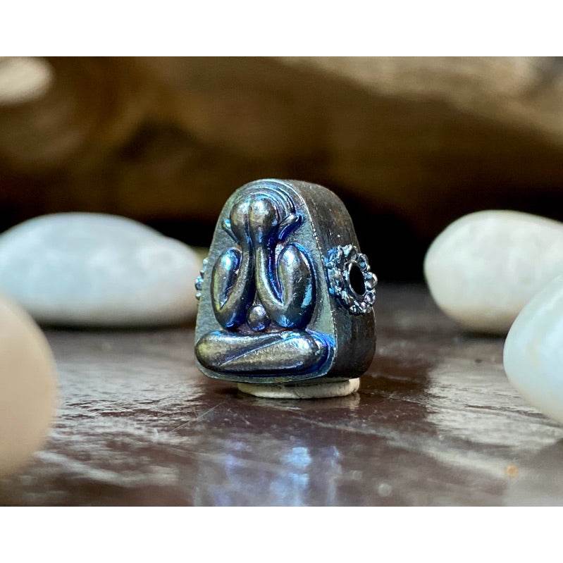 Thai billionaire wealth amulet Phra Pidta metal talisman with blue iridescent finish for wealth and protection