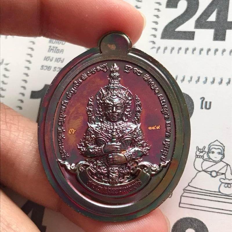 Handheld metallic Thai Thao Wessuwan amulet for wealth pendant with embossed guardian figure and ornate details