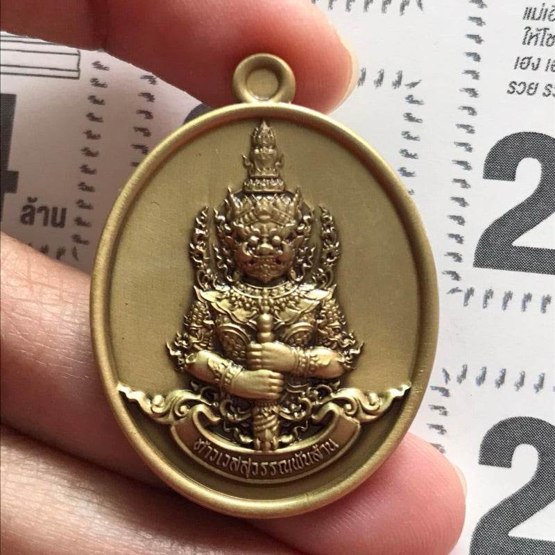 Thai Blessing Co Thao Wessuwan amulet for wealth brass oval pendant showing guardian deity